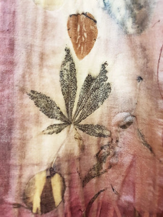 Pink and grey fabric dyed with natural plant matter.