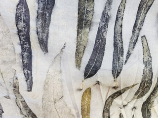 Fabric with a leaf pattern, dyed using plant matter.