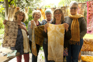 Eco Dye workshop at Fairholme Homestead. Students hold up their eco-dyed fabrics.