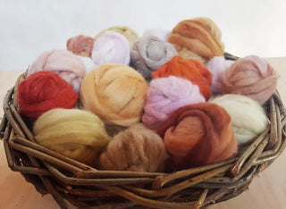 Merino wool balls dyed with plant materials.