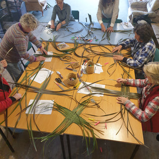 Students weave baskets out of Harakeke (NZ Flax) during their workshop.