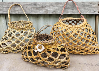Baskets woven from Harakeke NZ Flax, adorned with shells - NZ Textile Experiences.