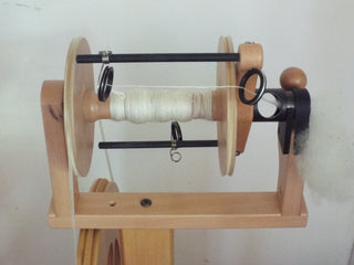 A spinning wheel for processing sheep wool.