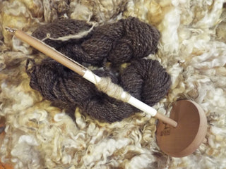 A wool spinning tool made from wood used to make skeins.