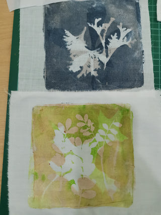 A Textile Collage artwork with foliage prints in yellow and grey.