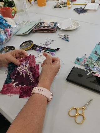 Students create their artworks at their Textile Collage workshop.