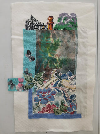 A Textile Collage artwork with birds and butterflies in a countryside scene.