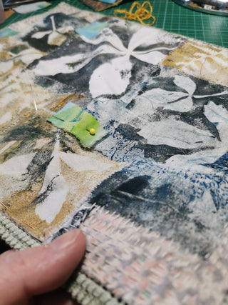 Students create their artworks at their Textile Collage workshop.