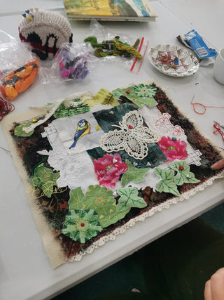 Students create their artworks at their Textile Collage workshop.