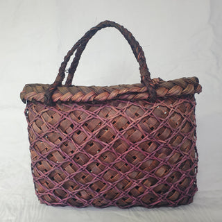 Traditional Māori Kete basket woven with purple brown Harakeke (NZ Flax).