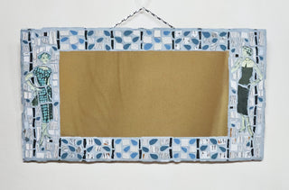 Mosaic mirror piece featuring two women in vintage outfits, surrounded by a blue abstract pattern.