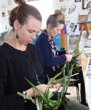 Students weaving their own NZ Flax (Harakeke) shopping baskets and bags.