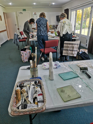 Students create their artworks at their Textile Collage workshop.